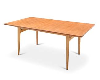 2052 Hans Wegner (1914-2007) A Model AT-312 teak dining table for Andreas Tuck, mid-20th century With two extension leaves at the ends, raised on attenuated legs Unmarked Height 28 1/2 in., width 65 in., depth 37 in.; width of each extension 18 1/2 in. Estimate: $1,500 - $2,000