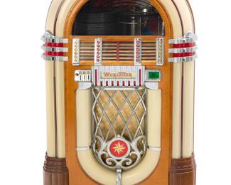 2326 A Wurlitzer jukebox model 1015 'The Bubbler' Designed 1946 by Paul Fuller (1897-1951) With 24 playable selections for 78 rpm vinyl records, featuring upper bubble tubes and opposed color wheel tubes Metal label verso: Wurlitzer Multi-Selector Phonograph / Manufactured by The Randolph Wurlitzer Company / Model 1015; serial number on plaque and stamped to wood: 1033121 Height 59 in., width 32 1/2 in., depth 24 1/2 in. Estimate: $3,000 - $5,000