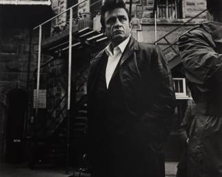 2234 Jim Marshall (1936-2010) Johnny Cash stepping off the bus at Folsom Prison, 1968 Gelatin silver print on paper From the edition of unknown size Signed, dated, and inscribed in pencil on the overmat directly below the image at lower right and lower left, respectively: Jim Marshall / 1968 / Johnny Cash Sight: 16 1/2 x 11 in. Estimate: $700 - $900