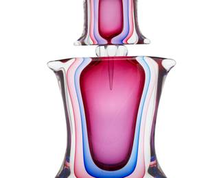 2073 Luigi Onesto (b. 1935) A large Murano cased glass perfume bottle, mid-20th century With stopper Incised to underside: L. Onesto Murano Italy Height overall 18 in., width 10 1/4 in., depth 3 1/2 in. Estimate: $500 - $700