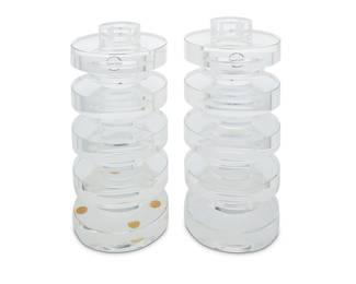 2316 Arik Levy (b. 1963) A pair of 'Giants' glass candlesticks for Gaia & Gino, early 21st century Designed 2007 Stacked clear glass cylinders, each with original factory formed box Each etched with factory marks and with applied label 2 pieces Height of each 10 5/8 in., diameter 4 3/4 in.; height of each box 6 3/4 in., width 12 5/8 in., depth 7 1/8 in. Estimate: $500 - $700