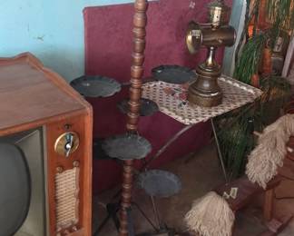 #126 Vintage MC Spanish Revival rotating metal and wooden plant stand with 5 tiers and 4 hooks 60" tall $50.00