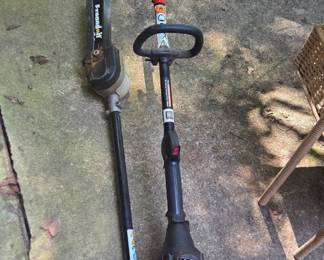 #112 Troy Bilt curved shaft gas trimmer TB 22EC with 10" chainsaw attachment $80.00