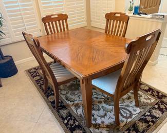 Fine oak dining table with leaf, 2 arm chairs and 4 side chairs