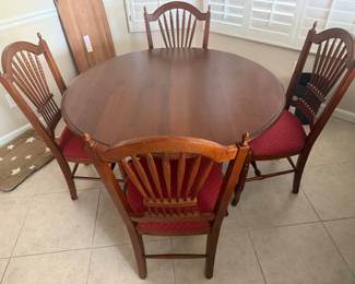 Ethan Allen dining table with leaf and four chairs