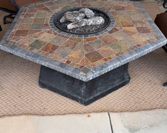 Propane, fire pit, and stone table
