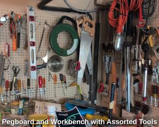 Pegboard and Workbench with Assorted Tools