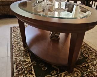 Oval Wood and Glass Coffee Table with Storage Shelf second image