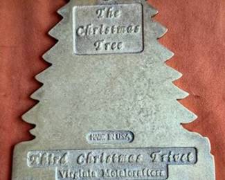Virginia Metalcrafters solid brass wall plaques with Christmas motifs. Includes plaques shaped as Santa, Christmas tree, MERRY CHRISTMAS sleigh, holly, and leaves. All items are marked VM and dated pieces from 1981 and 1987.