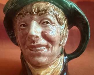 Royal Doulton character mugs, including 'Arriet', 'Bully Boy', and 'Beefeater', all marked on the base. Glazed ceramic ware with detailed hand-painted features, produced by Doulton & Co. Limited.