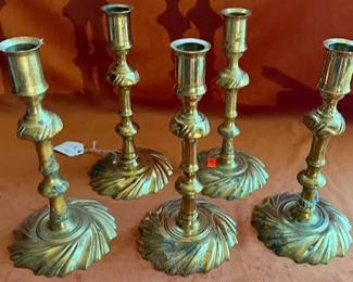 Brass candle holders, each with ornate bases and baroque-style detailing. Bases are marked 'GWC120' and display additional hallmarks. 