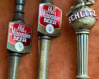 Old Milwaukee beer tap handles and one Schlitz tap handle.