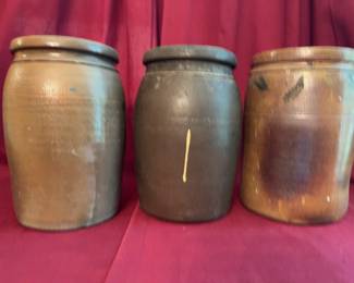 Three stoneware crocks, each approximately 9.5 inches tall. One crock is marked with "M.B. Taylor, Richmond, Va." 