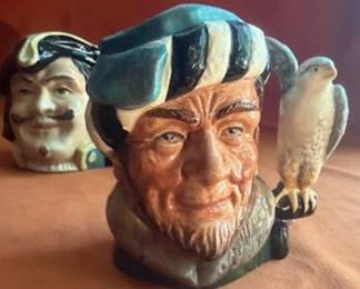 Royal Doulton ceramic character jugs including Bacchus, Granny, Drake, The Lumberjack, Long John Silver, and Captain Henry Morgan. Each jug features hand-painted details and Doulton backstamps.