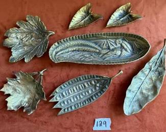 Metal leaf-shaped dishes, including a marked VCM 'Pheasant Good' tray from the 1967 National Tobacco Festival in Richmond, VA.