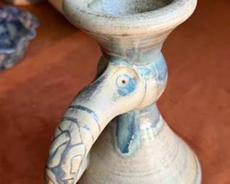 Studio pottery including a Chamberlain rectangular dish with painted interior, a Celtic Clays Carlingford bowl, a candlestick holder with a bird motif, and additional candle holders and dishes. Varied glazes and forms are present. Several bases are marked.