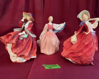 Royal Doulton porcelain figurines, each depicting a lady in period dress. Models include "Top O' the Hill," "Gaiety," and "Daydreams." The tallest stands up to 8 inches tall. Includes maker marks on bases.