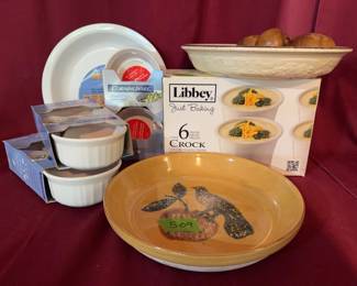 Libbey Just Baking 6-piece crock set, CorningWare French White and SimplyLite baking dishes, a Pfaltzgraff stoneware pie plate, a floral bowl marked "Oven Serve," and wooden fruit pieces.