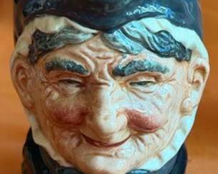 Royal Doulton ceramic character jugs including Bacchus, Granny, Drake, The Lumberjack, Long John Silver, and Captain Henry Morgan. Each jug features hand-painted details and Doulton backstamps.