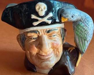 Royal Doulton ceramic character jugs including Bacchus, Granny, Drake, The Lumberjack, Long John Silver, and Captain Henry Morgan. Each jug features hand-painted details and Doulton backstamps.