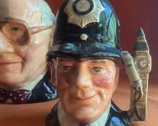 Royal Doulton character jugs, including Sir Henry Doulton, John Doulton, The London Bobby, and other notable British figures. Marked on bases, some as limited editions. Hand-painted ceramic construction.