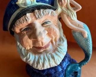Royal Doulton character jug titled "Old Salt," model D6551. Features a sailor with a blue cap and beard, with a mermaid as the handle. Marked with Royal Doulton stamp and copyright 1960.