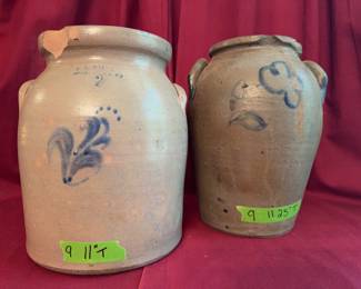 Stoneware crocks, each with applied handles and cobalt blue floral decoration. One marked A.K. Ballard, Burlington, VT, with a capacity stamp and chip to the rim. Heights approx. 9 11/16 in. and 9 11.25 in.