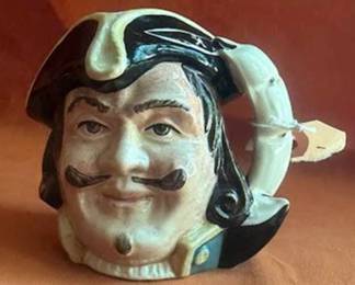 Royal Doulton ceramic character jugs including Bacchus, Granny, Drake, The Lumberjack, Long John Silver, and Captain Henry Morgan. Each jug features hand-painted details and Doulton backstamps.