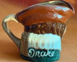 Royal Doulton ceramic character jugs including Bacchus, Granny, Drake, The Lumberjack, Long John Silver, and Captain Henry Morgan. Each jug features hand-painted details and Doulton backstamps.
