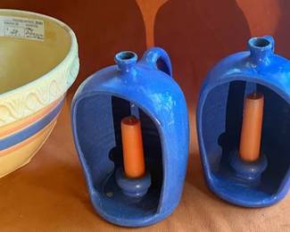 TerraWare 9.5" baking dish, a large mixing bowl with decorative banding, a small lidded jar, and a pair of blue handled stoneware candle holders. All pieces are ceramic or stoneware.