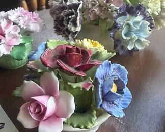 Hand modeled and hand painted bone china floral arrangements. Makers include Royal Adderley and Aynsley. Each features multi-color flowers in floral pots, marked Made in England.