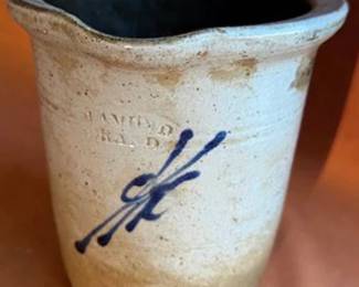 Handmade studio pottery items, including bowls, a handled mug, and dishes. Two pieces signed "Robin" and one with an incised mark. Features hand-painted designs and varied glazes. Unique, collectible functional stoneware.