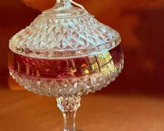 uby red glass pitcher, Avon ruby red goblet, ruby red brandy snifter, clear glass compote with ruby band, divided serving tray, and clear glass dishes.