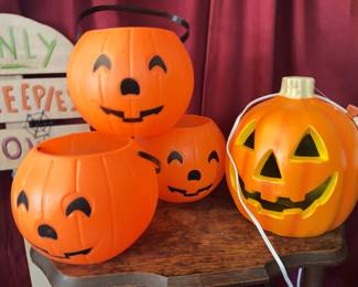 Plastic jack-o'-lantern pails, light-up pumpkin, 'Only Creepies Allowed' yard sign, Halloween Flame Light Cauldron, Pumpkin Masters Power Saw carving tool, 18-inch Glowing Moon Window Sculpture, two boxes of 70-count Halloween lights.