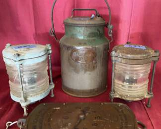Penn Scale Mfg. Co. 30 lb capacity spring balance scale, a metal milk can marked 'Curles Neck Farm 102' with handle and copper plaque, and two metal-framed glass lanterns.