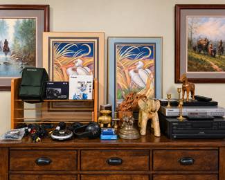 Worked for 38s  A wonderful mix of estate sale finds, including framed wildlife art from the Worlds Fairand Western artwork, Canon camera equipment, a camera bag, electronics, headphones, audio/video components, brass candlesticks, carved elephant and horse décor, driftwood art, and other unique decorative collectibles.