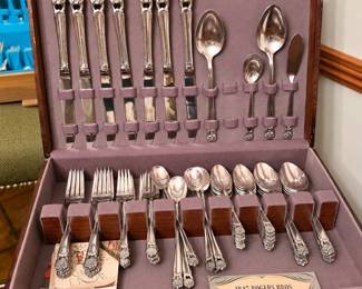 Beautiful vintage 1847 Rogers Bros. silverplate flatware set in its original wooden storage chest. This large collection includes knives, forks, spoons, serving utensils, and original informational inserts—an elegant set perfect for entertaining, holiday dinners, or collectors!