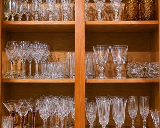 Crystal and glassware lovers, don’t miss this beautiful collection! The cabinet is filled with elegant wine glasses, goblets, champagne flutes, martini glasses, tumblers, etched stemware, amber drinking glasses, small glass dishes, and a charming crystal clock. A wonderful selection for entertaining, holiday tables, weddings, or collectors!