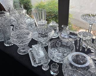 Large collection of cut and pressed crystal and glasswareed jars, bowls, vases, compotes, candlesticks, serving pieces, cruets es in a variety of traditional patterns.