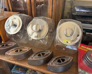 Vintage irons and glass candy canisters
