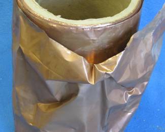 Lot 323. 12 inches wide copper roll weighing 8.4 lbs. with the paper tube