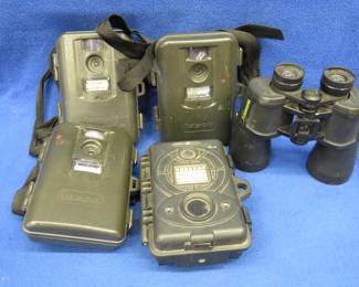 Lot 126. Bushnell 12-50 binoculars, three Tasco trail cameras, one Spy Point trail camera