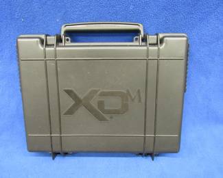 Lot 192. WCX new hard case including 2 holsters and lock for a 9 mm