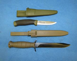 Lot 144. Two fixed blade knives with hard shell cases. A Glock made in Austria and a Frosts made in Sweden.