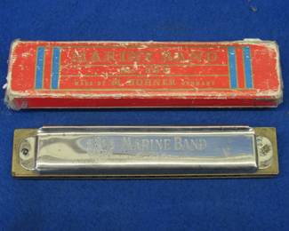 Lot 163. Hohner 14-hole diatonic Marine Band harmonica in the key of C with the box. Sounds great.