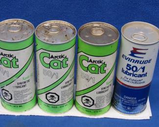 Lot 185. Three 16 oz. vintage paper Arctic Cat 50/1 lubricant and one 16 oz. metal can of Evinrude 50/1 lubricant