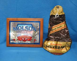 Lot 38. Molson advertising mirror 20" x 16" and an inflatable Metbrau advertising can