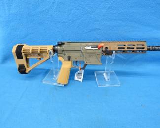 Lot 25. Palmetto State Armory Sabre AR-V 9mm pistol with a brace. S/N AAG000010. Won at a banquet and never fired. Includes one magazine and the original box.