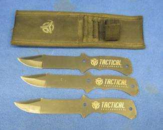 Lot 81. Set of three Tactical Performance throwing knives with a sheath and archery tuning items