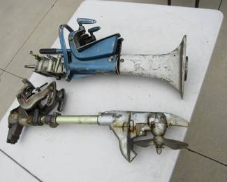 Lot 104. Two antique partial outboard motors